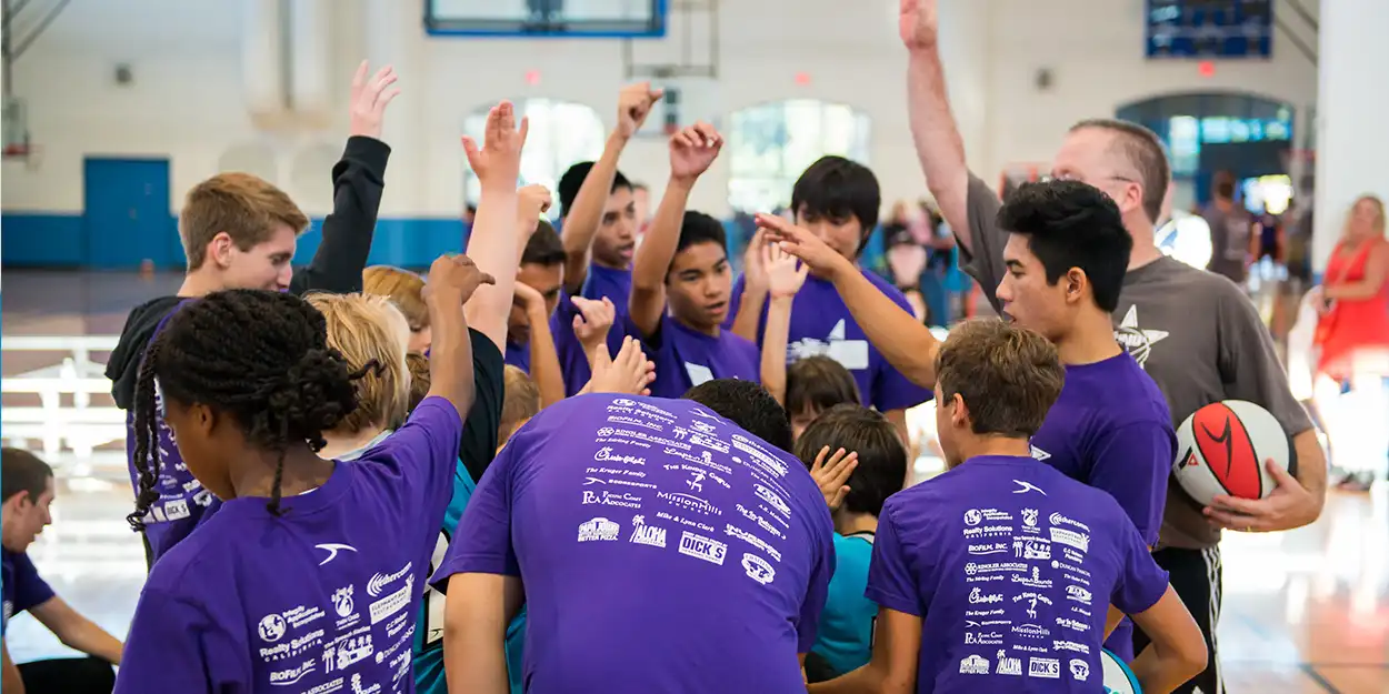 image of basketball buddies in huddle